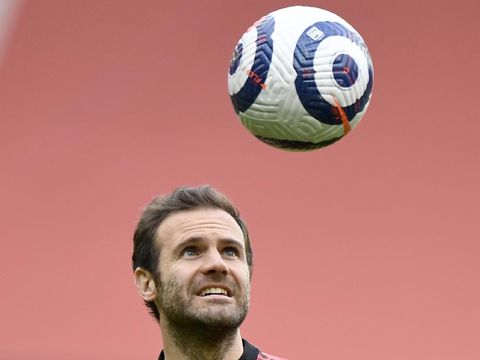 Manchester United's Juan Mata heads the ball during warm up before the English Premier League soccer match between Manchester United and Leicester City, at the Old Trafford stadium in Manchester, England, Tuesday, May 11, 2021. (Peter Powell/Pool via AP)