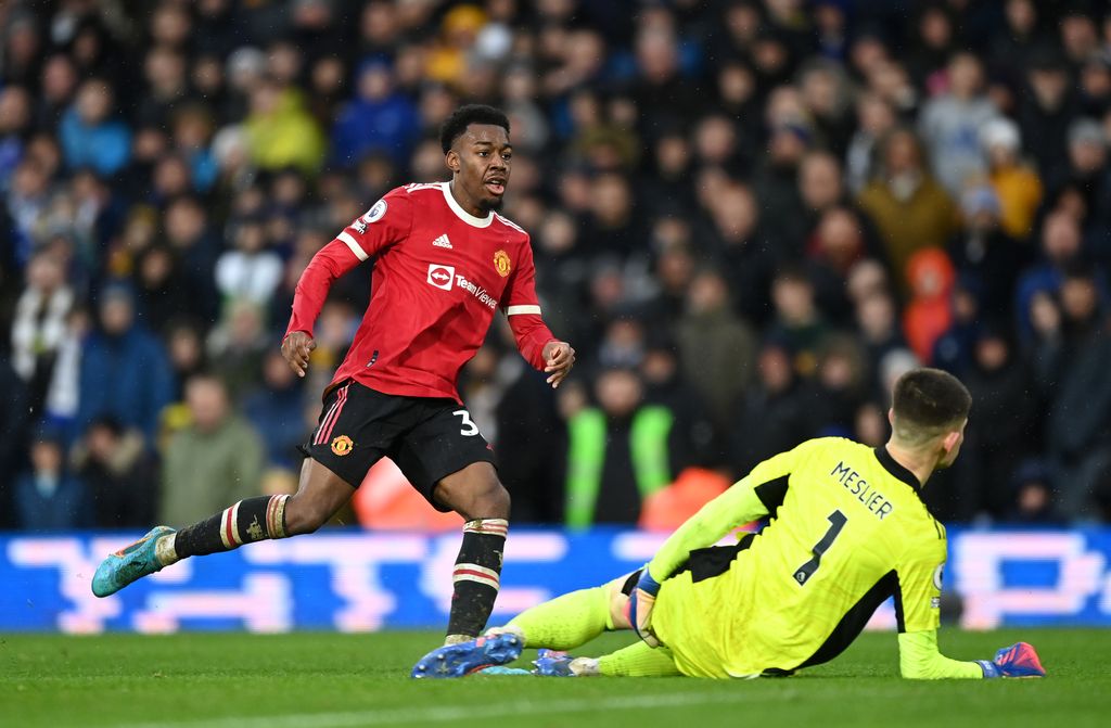 LEEDS, ENGLAND - FEBRUARY 20: Anthony Elanga of Manchester United scores their team's fourth goal past Illan Meslier of Leeds United during the Premier League match between Leeds United and Manchester United at Elland Road on February 20, 2022 in Leeds, England. (Photo by Shaun Botterill/Getty Images)