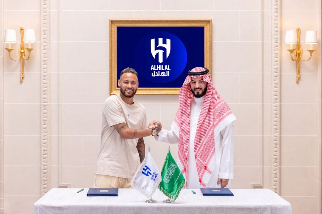 Soccer Football - Neymar signs for Al Hilal - Paris, France - August 15, 2023 Al Hilal's new signing Neymar shakes hands as he poses with President Fahd bin Saad Al-Nafel Saudi Pro League/Handout via REUTERS??ATTENTION EDITORS - THIS IMAGE HAS BEEN SUPPLIED BY A THIRD PARTY.