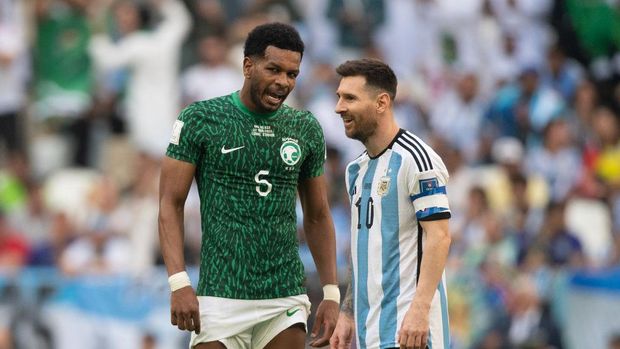 LUSAIL CITY, QATAR - NOVEMBER 22: Ali Al-Bulayhi of Saudi Arabia and Lionel Messi of Argentina during the FIFA World Cup Qatar 2022 Group C match between Argentina and Saudi Arabia at Lusail Stadium on November 22, 2022 in Lusail City, Qatar. (Photo by Visionhaus/Getty Images)