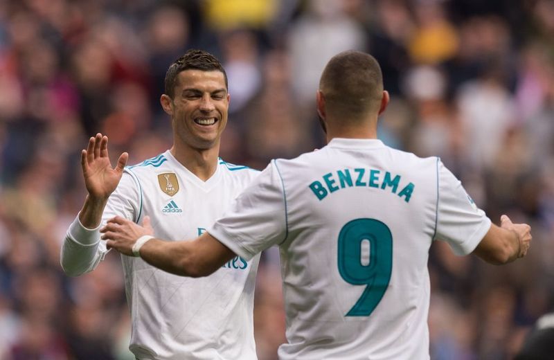 MADRID, SPAIN - DECEMBER 08:  Cristiano Ronaldo of Real Madrid celebrates with Karim Benzema after scoring Real's 6th goal during the UEFA Champions League Group A match between Real Madrid CF and Malmo FF at the Santiago Bernabeu stadium on December 8, 2015 in Madrid, Spain.  (Photo by Denis Doyle/Getty Images)
