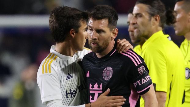 Feb 25, 2024; Carson, California, USA; Inter Miami CF forward Lionel Messi (10) with LA Galaxy midfielder Riqui Puig (10) after the game at Dignity Health Sports Park. Mandatory Credit: Kiyoshi Mio-USA TODAY Sports